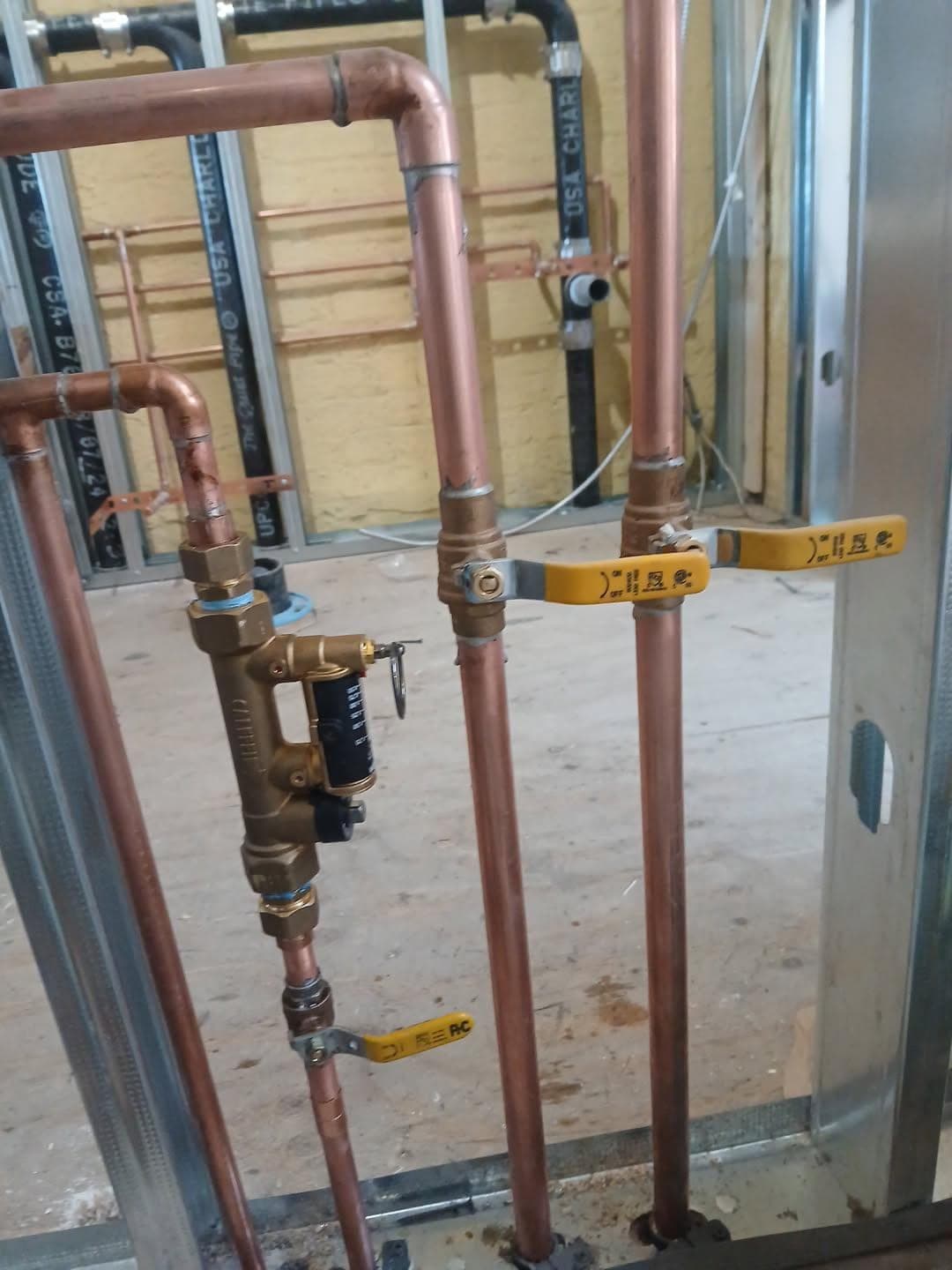 New copper water lines with shut-off valves and a pressure-reducing valve