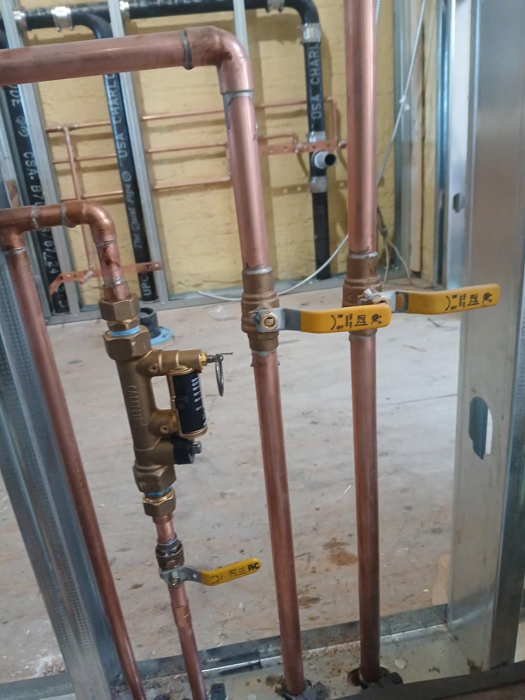 New copper water lines with shut-off valves and a pressure-reducing valve