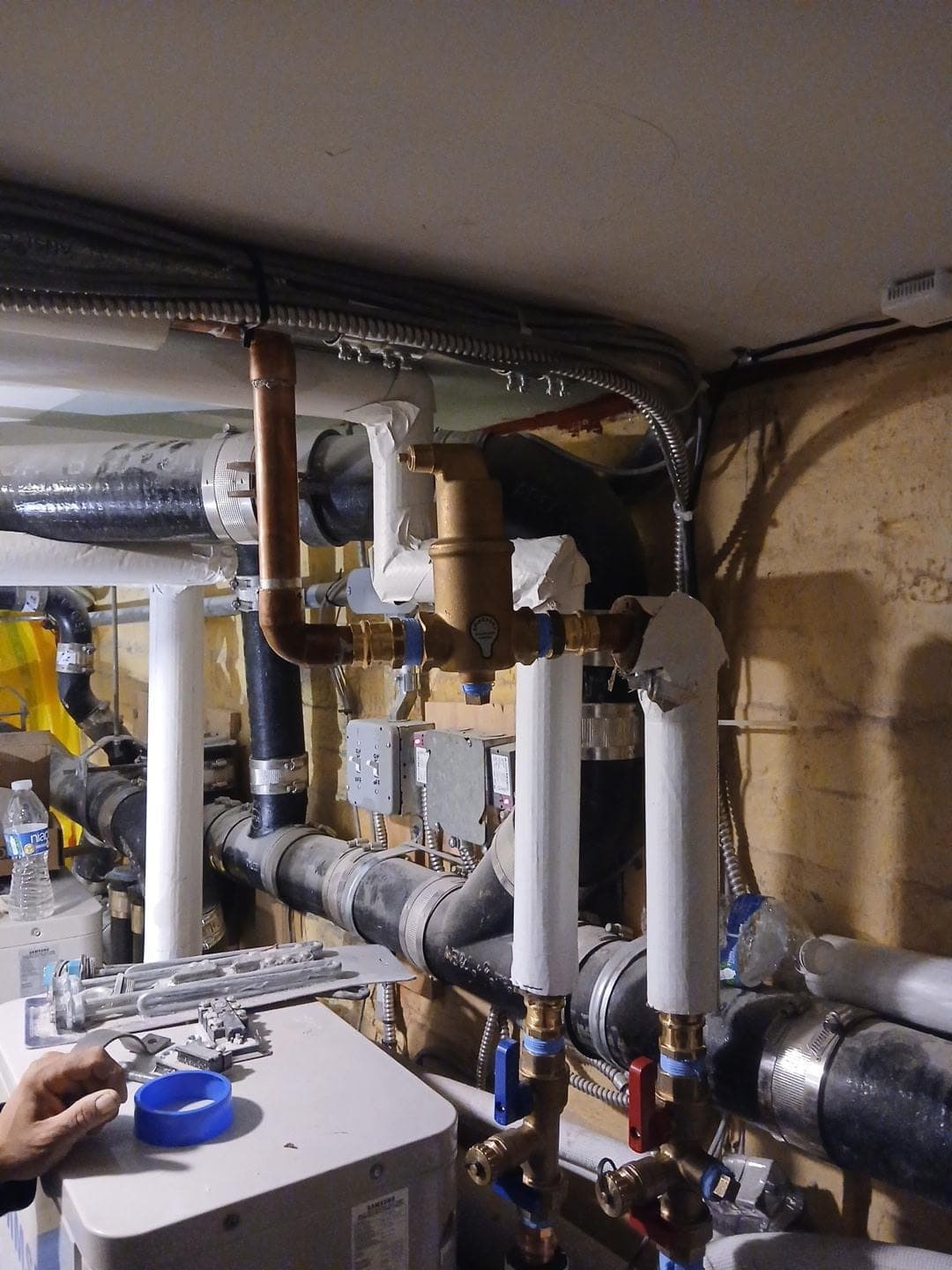 Mechanical room with copper, insulated and black steel piping