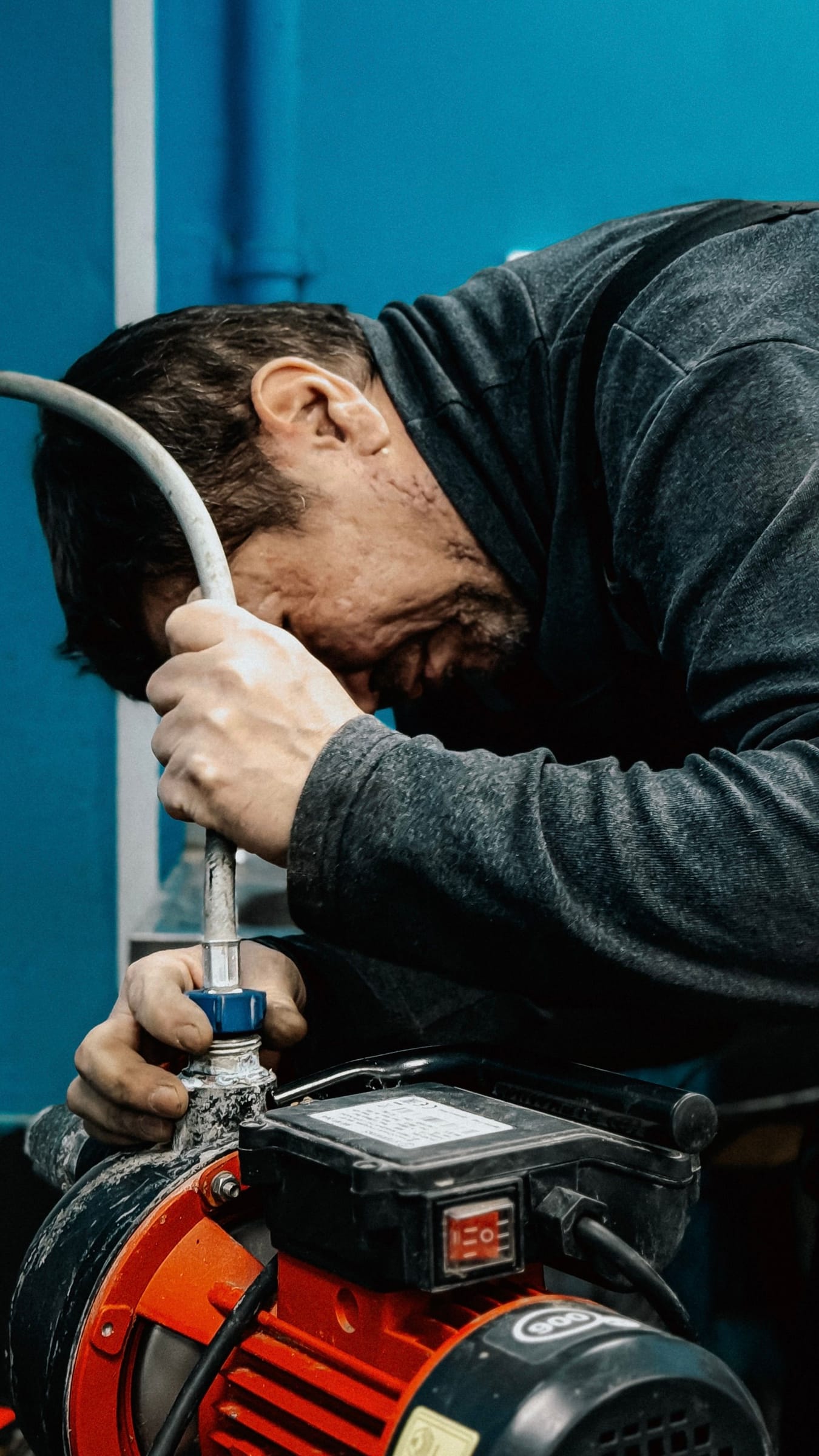 Technician working on the connection of an electric water pump
